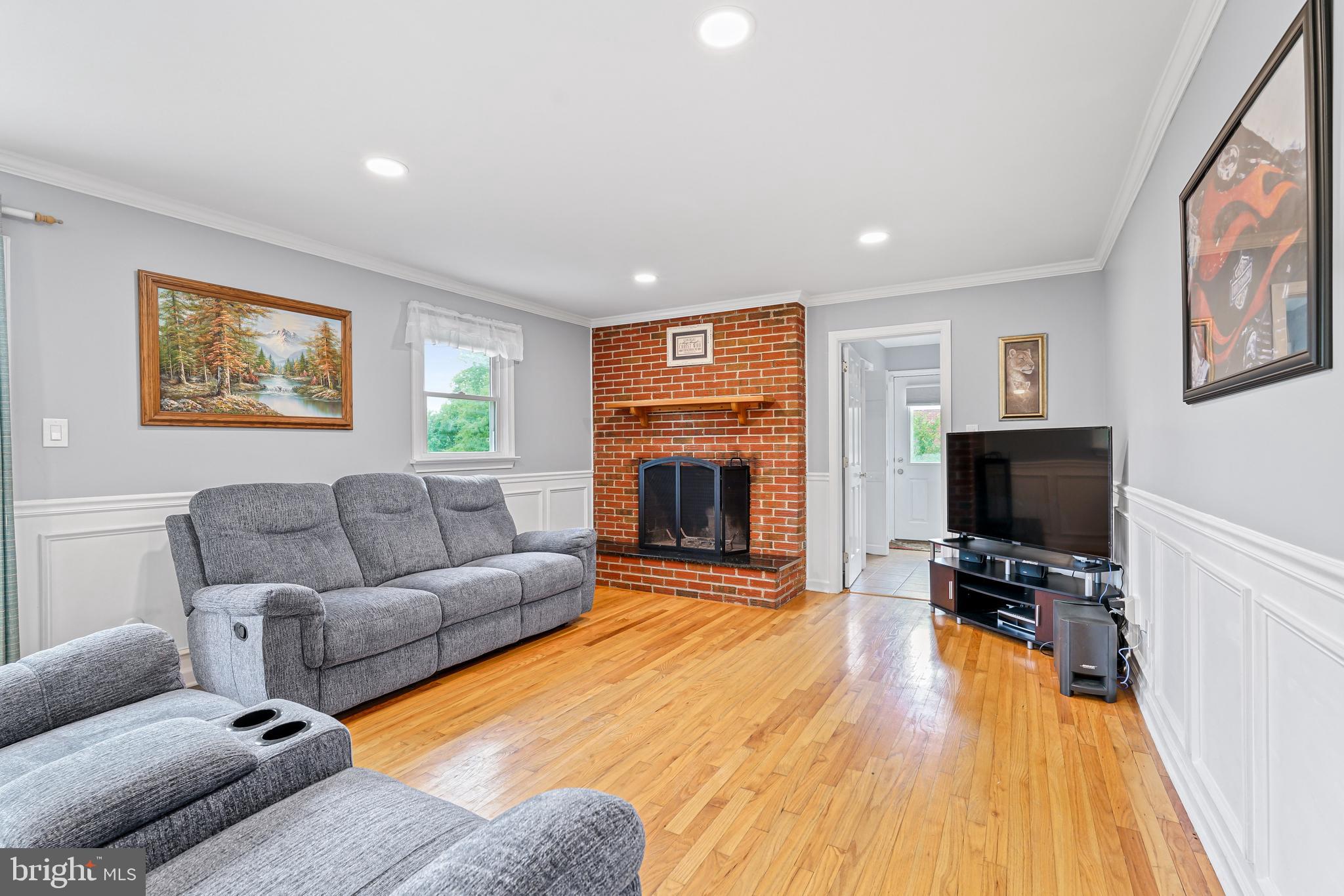 7 Congress Drive Bear, DE 19701 - Photo 13 of 37 a living room with furniture and a flat screen tv