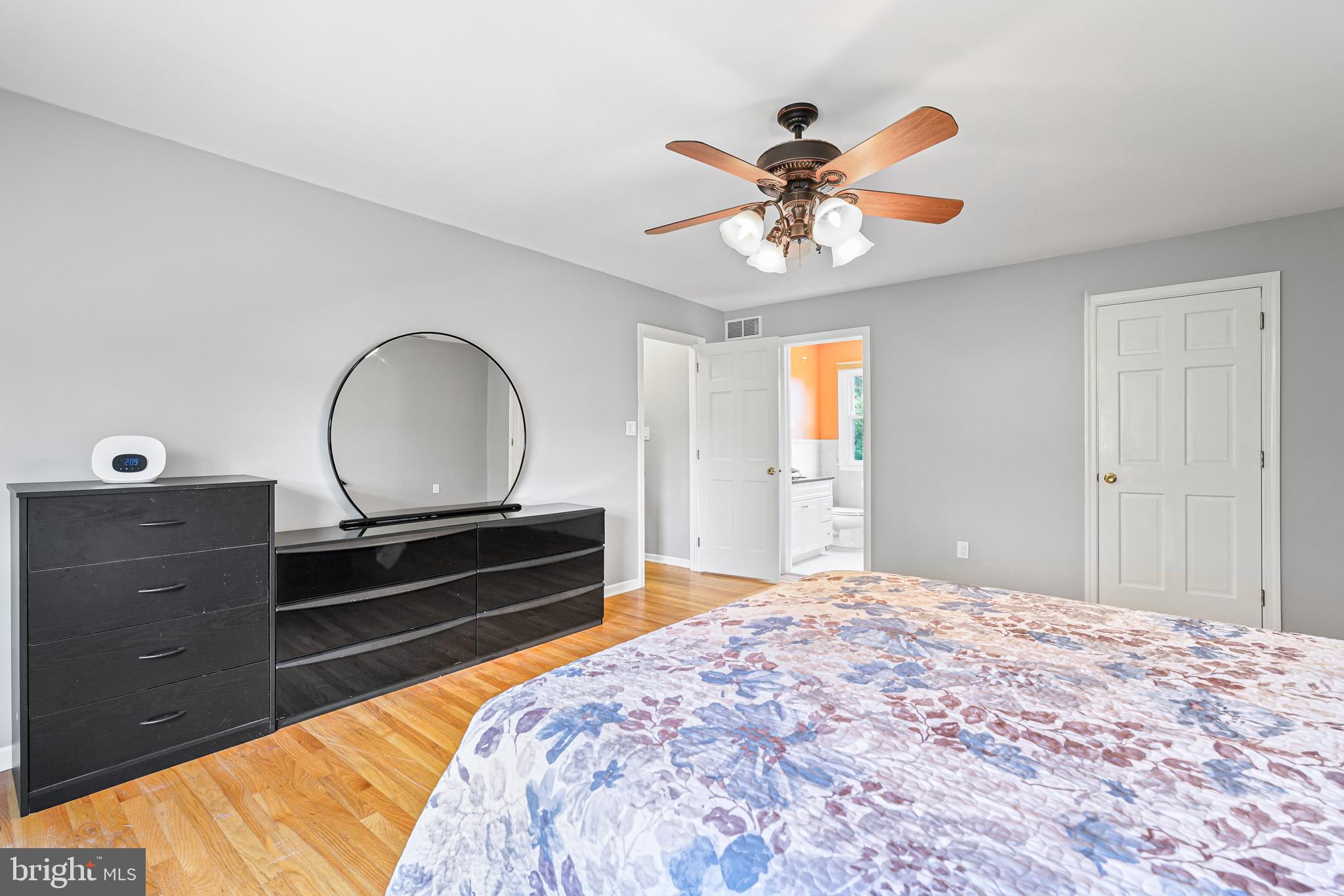 7 Congress Drive Bear, DE 19701 - Photo 19 of 37 a bedroom with a bed and a chandelier