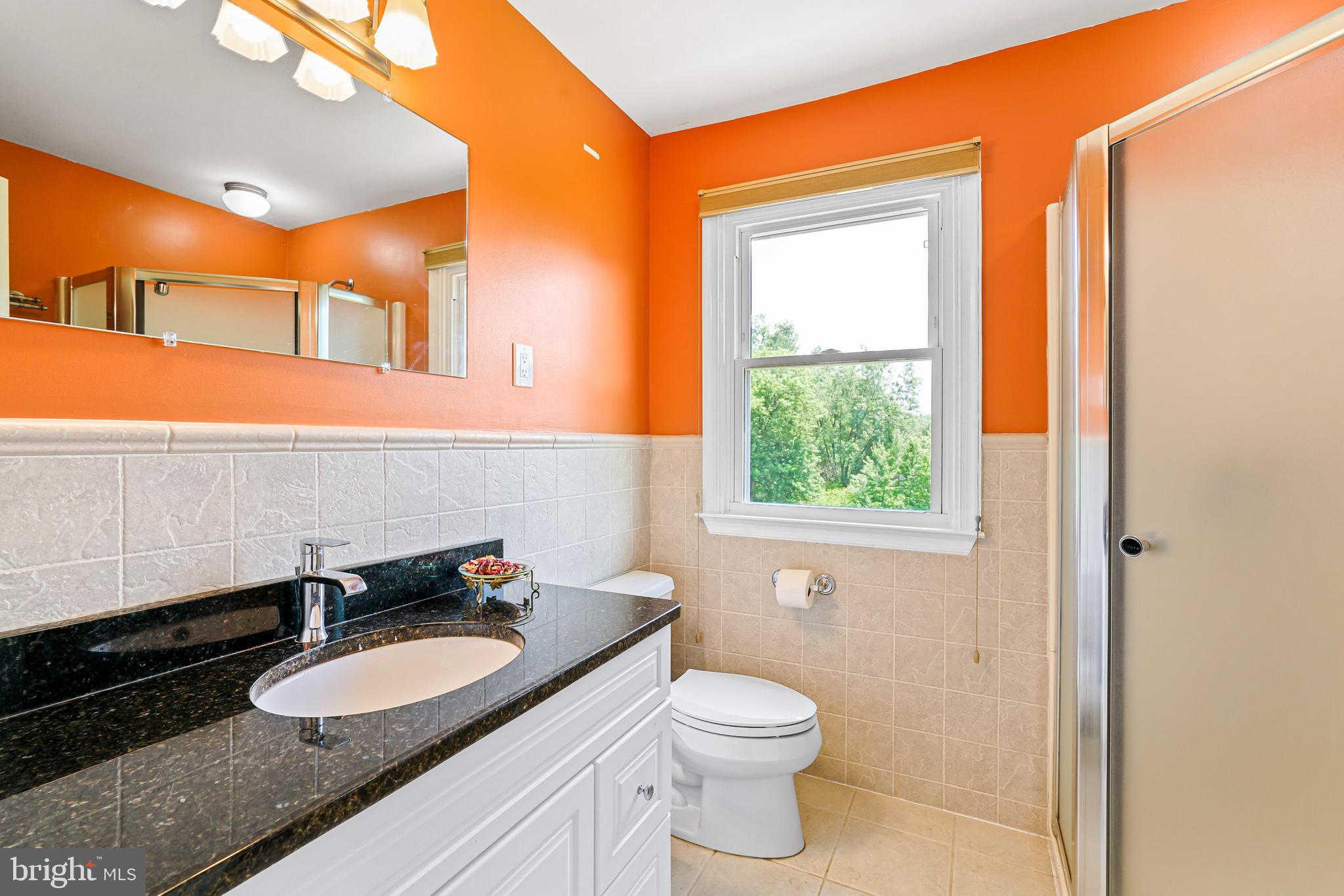 7 Congress Drive Bear, DE 19701 - Photo 20 of 37 a bathroom with a granite countertop sink and a mirror