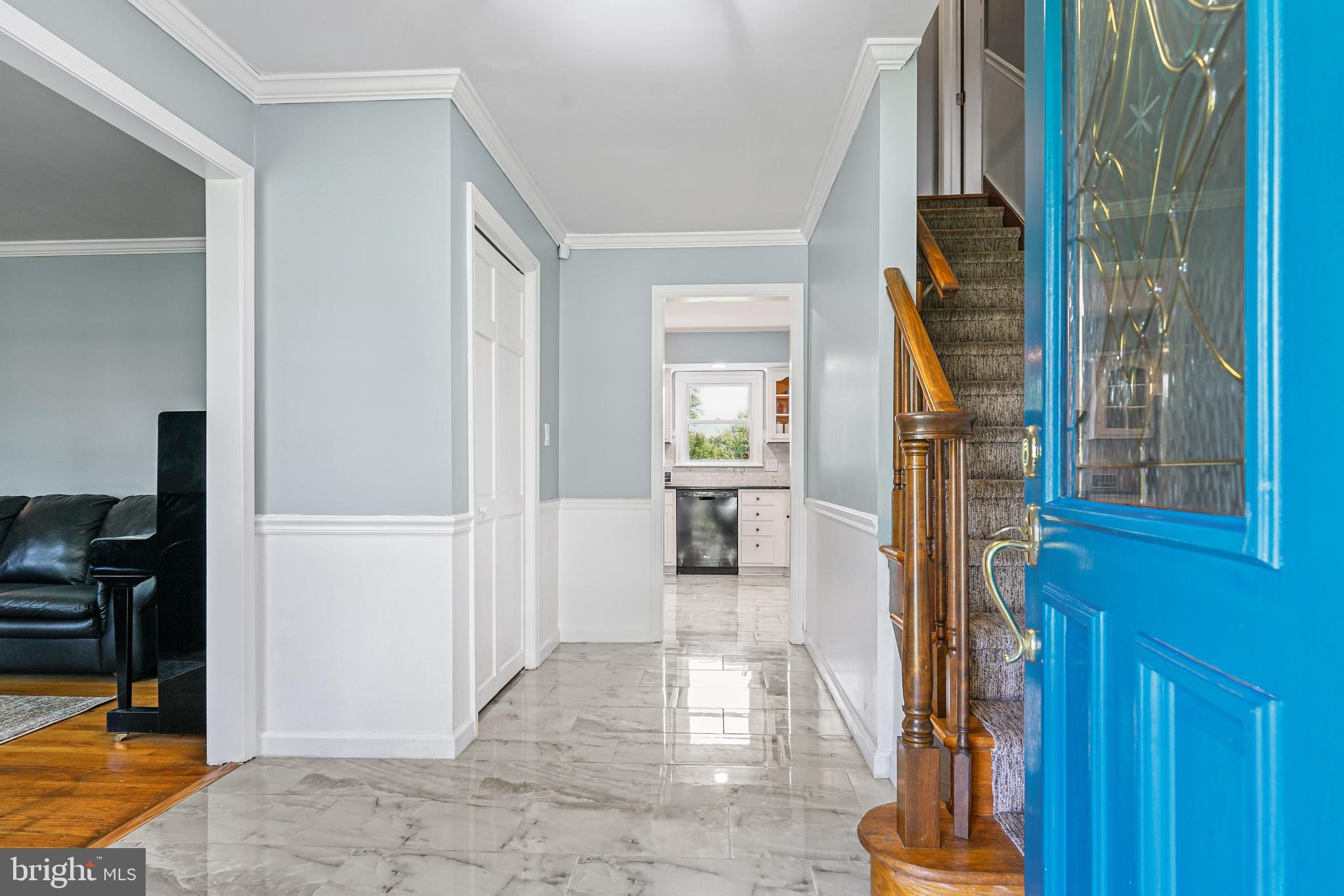 7 Congress Drive Bear, DE 19701 - Photo 2 of 37 a view of a hallway with wooden floor and a living room