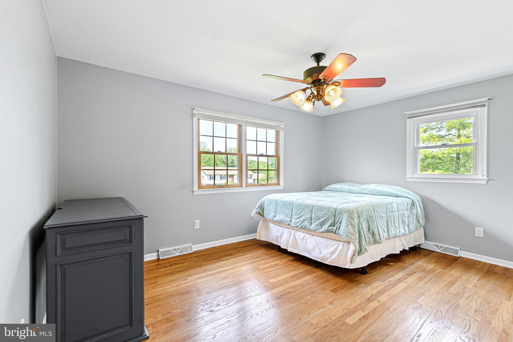 7 Congress Drive Bear, DE 19701 - Photo 23 of 37 a bedroom with a bed and a chandelier