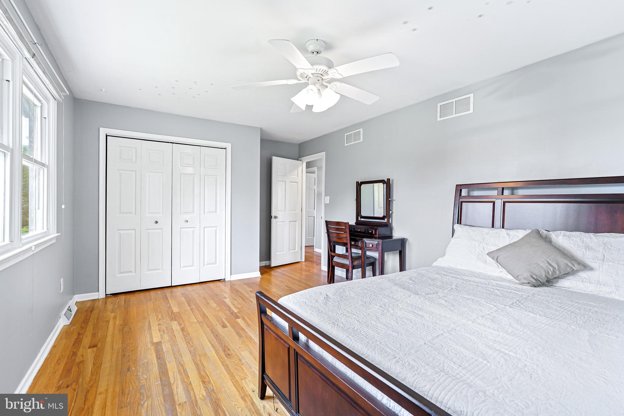 7 Congress Drive Bear, DE 19701 - Photo 26 of 37 a bedroom with a large bed and a chandelier