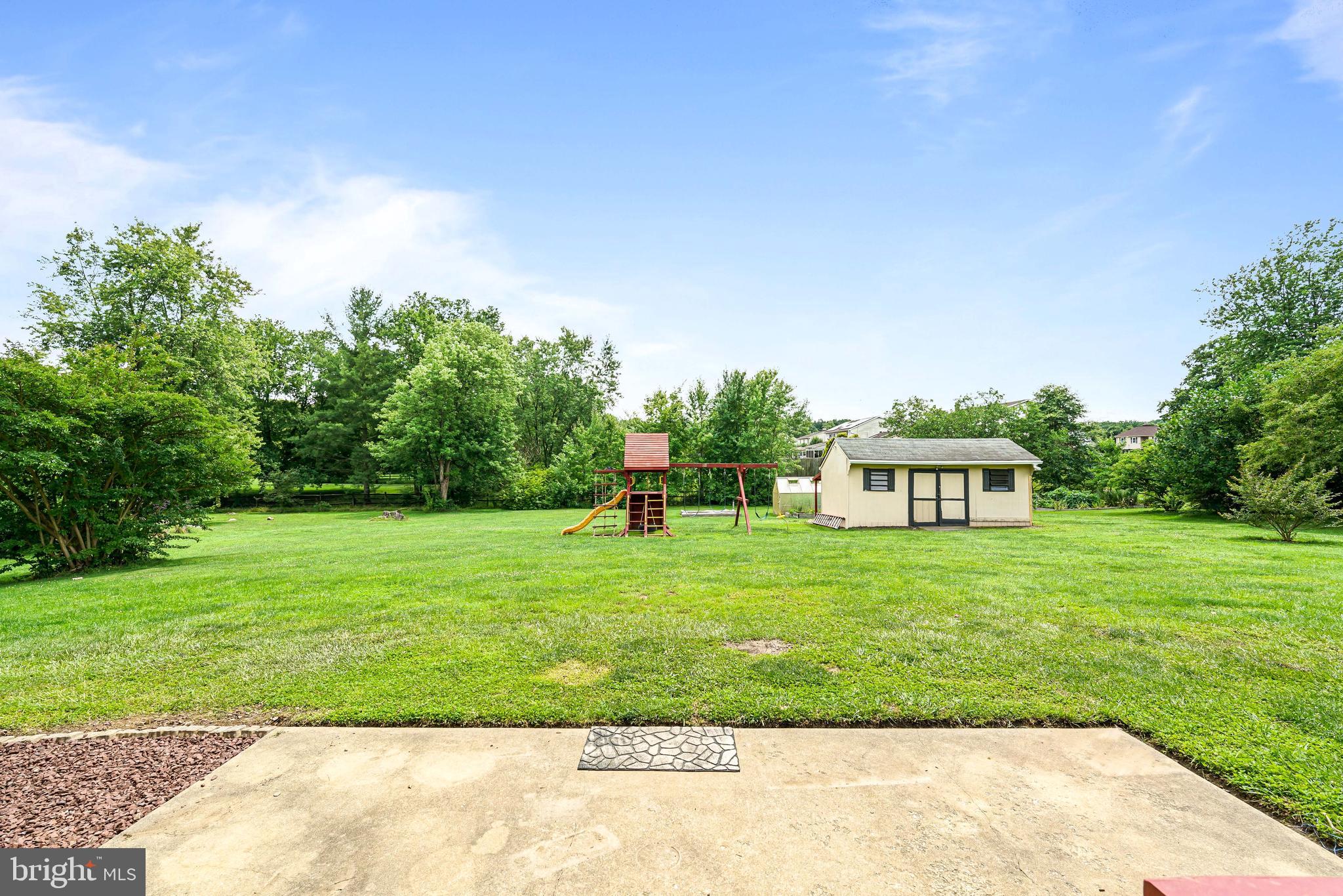 7 Congress Drive Bear, DE 19701 - Photo 31 of 37 a front view of a house with a garden