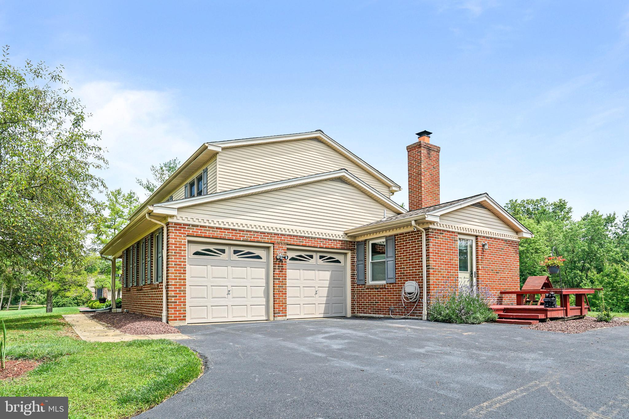 7 Congress Drive Bear, DE 19701 - Photo 36 of 37 a front view of a house with a garden and trees