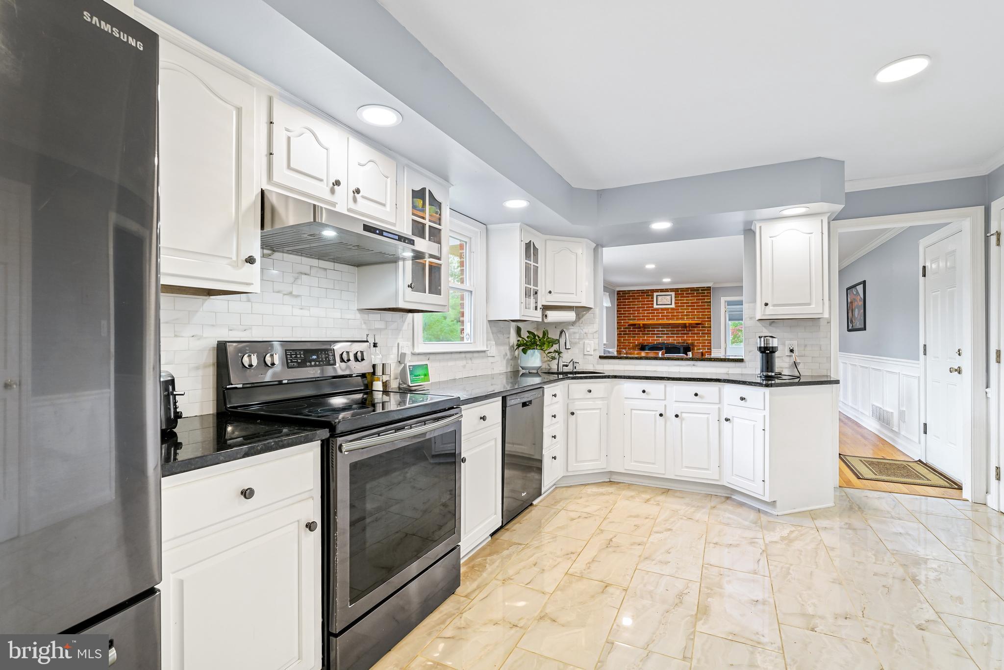 7 Congress Drive Bear, DE 19701 - Photo 8 of 37 a kitchen with stainless steel appliances a stove sink and refrigerator