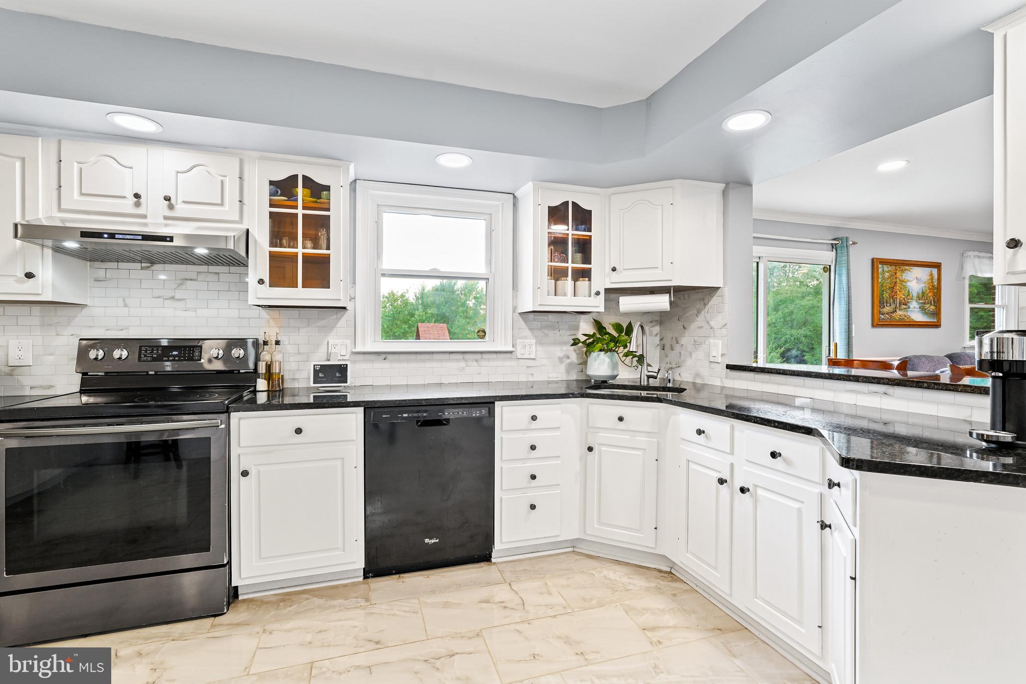 7 Congress Drive Bear, DE 19701 - Photo 9 of 37 a kitchen with granite countertop cabinets stainless steel appliances and a window