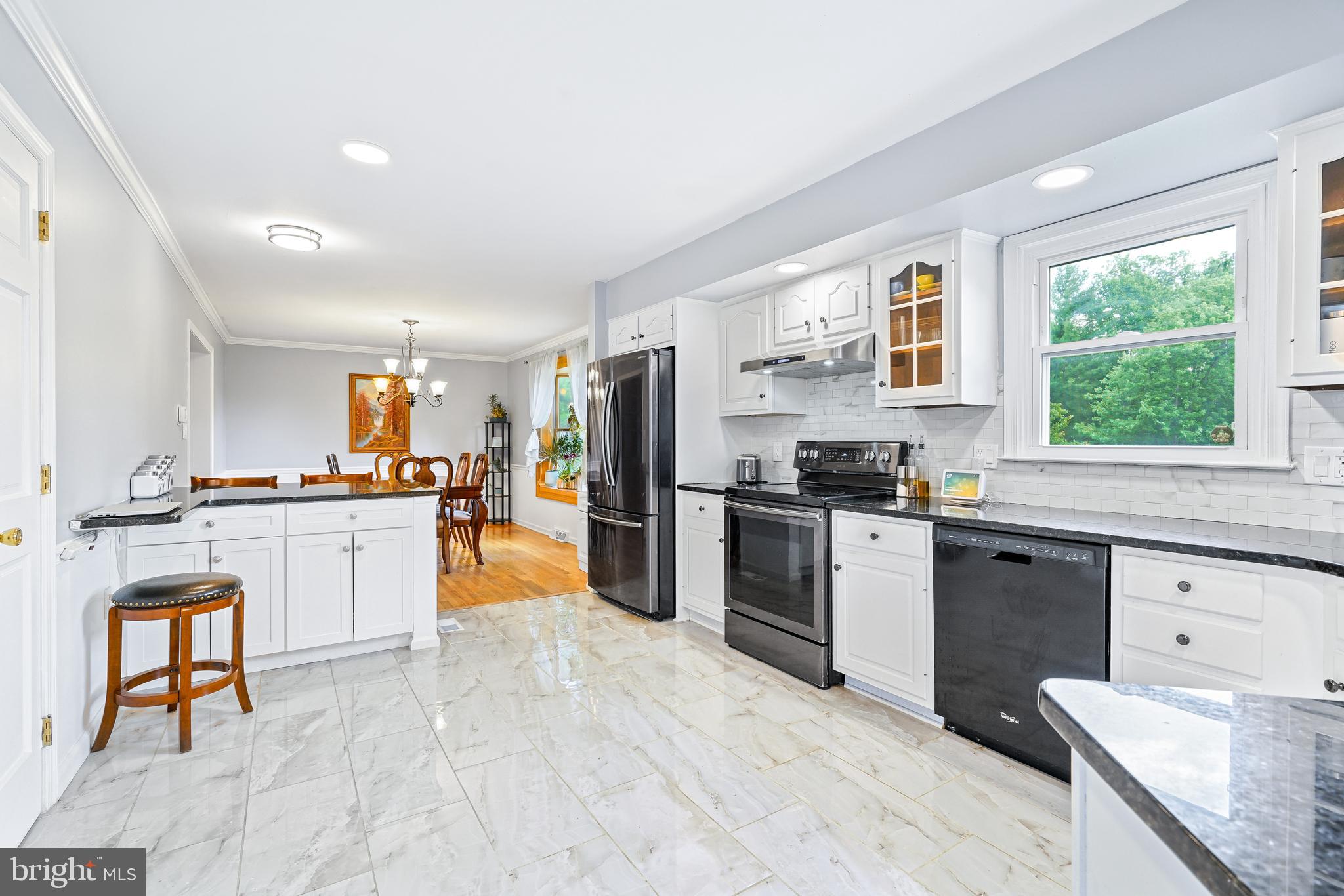 7 Congress Drive Bear, DE 19701 - Photo 10 of 37 a kitchen with a refrigerator and a stove top oven