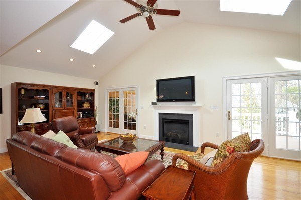9 Oldham Road Arlington, MA 02474 - Photo 12 of 29 a living room with furniture and a fireplace