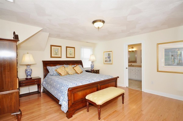 9 Oldham Road Arlington, MA 02474 - Photo 20 of 29 a bedroom with a bed and a table