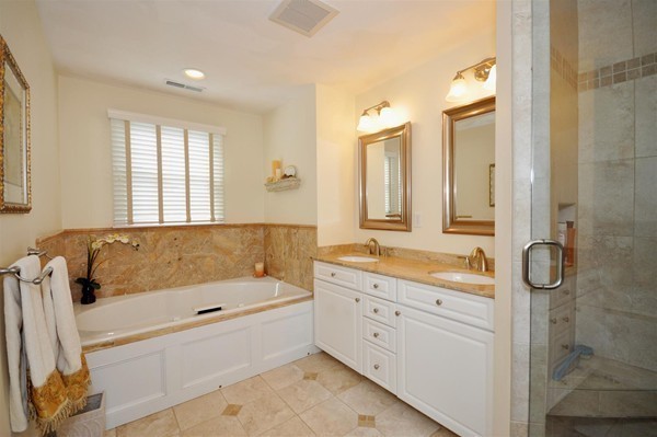 9 Oldham Road Arlington, MA 02474 - Photo 21 of 29 a bathroom with a tub sink and mirror