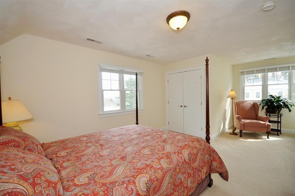 9 Oldham Road Arlington, MA 02474 - Photo 22 of 29 a bedroom with a bed and furniture