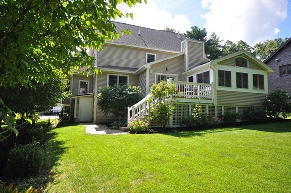 9 Oldham Road Arlington, MA 02474 - Photo 29 of 29 a front view of a house with a garden and yard