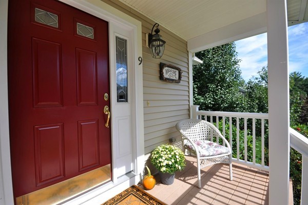 9 Oldham Road Arlington, MA 02474 - Photo 3 of 29 a balcony with wooden floor and outdoor seating