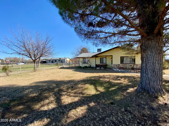 a view of swimming pool with a yard