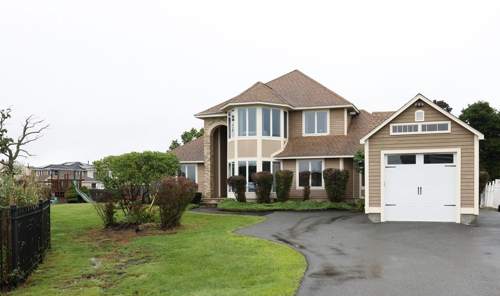 27 Beachview Avenue Saugus, MA 01906 - Photo 1 of 38 a front view of a house with garden