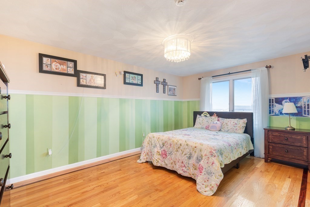 27 Beachview Avenue Saugus, MA 01906 - Photo 24 of 38 a bedroom with a bed window and a dresser