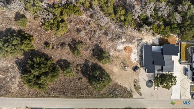 an aerial view of residential house with outdoor space