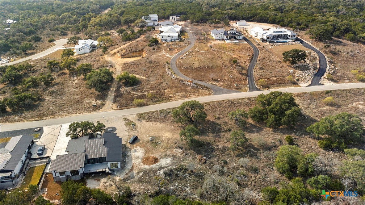2603 Campestres Spring Branch, TX 78070 - Photo 7 of 7 an aerial view of a house with a yard and lake view