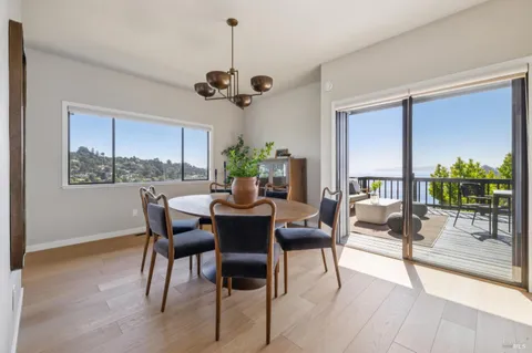 a view of a balcony with table and chairs