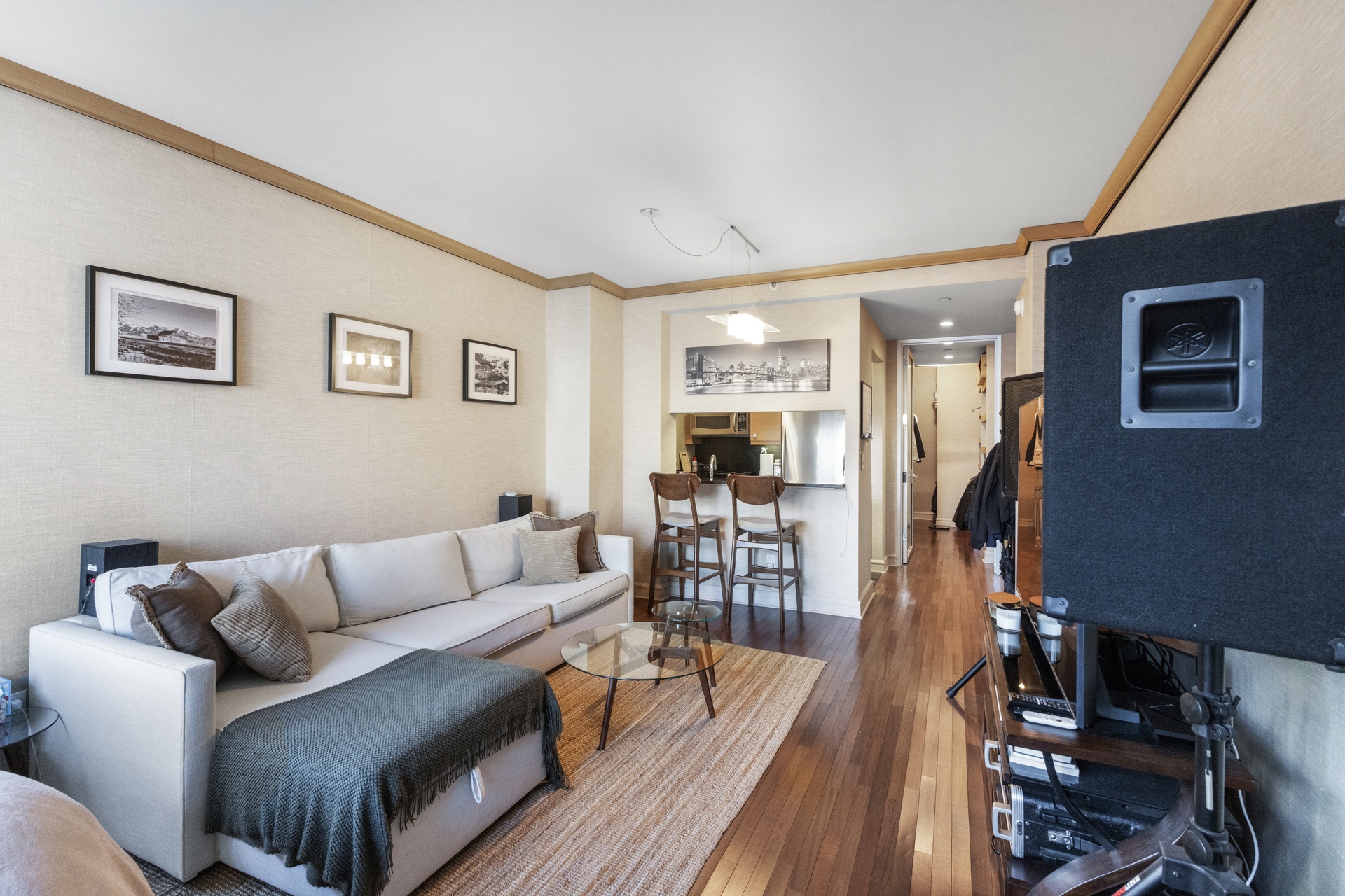 120 Riverside Boulevard, Unit 14C Manhattan, NY 10069 - Photo 4 of 11 a living room with furniture and wooden floor