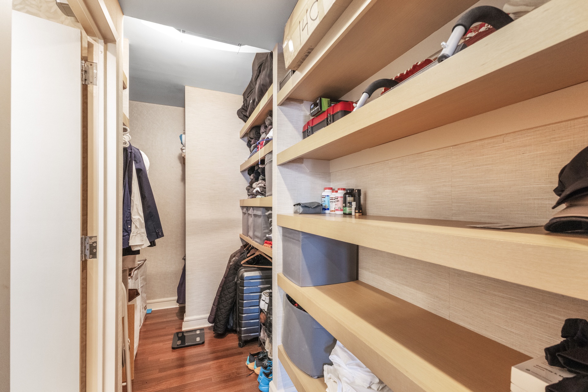 120 Riverside Boulevard, Unit 14C Manhattan, NY 10069 - Photo 5 of 11 a view of walk in closet with clothes and shoes
