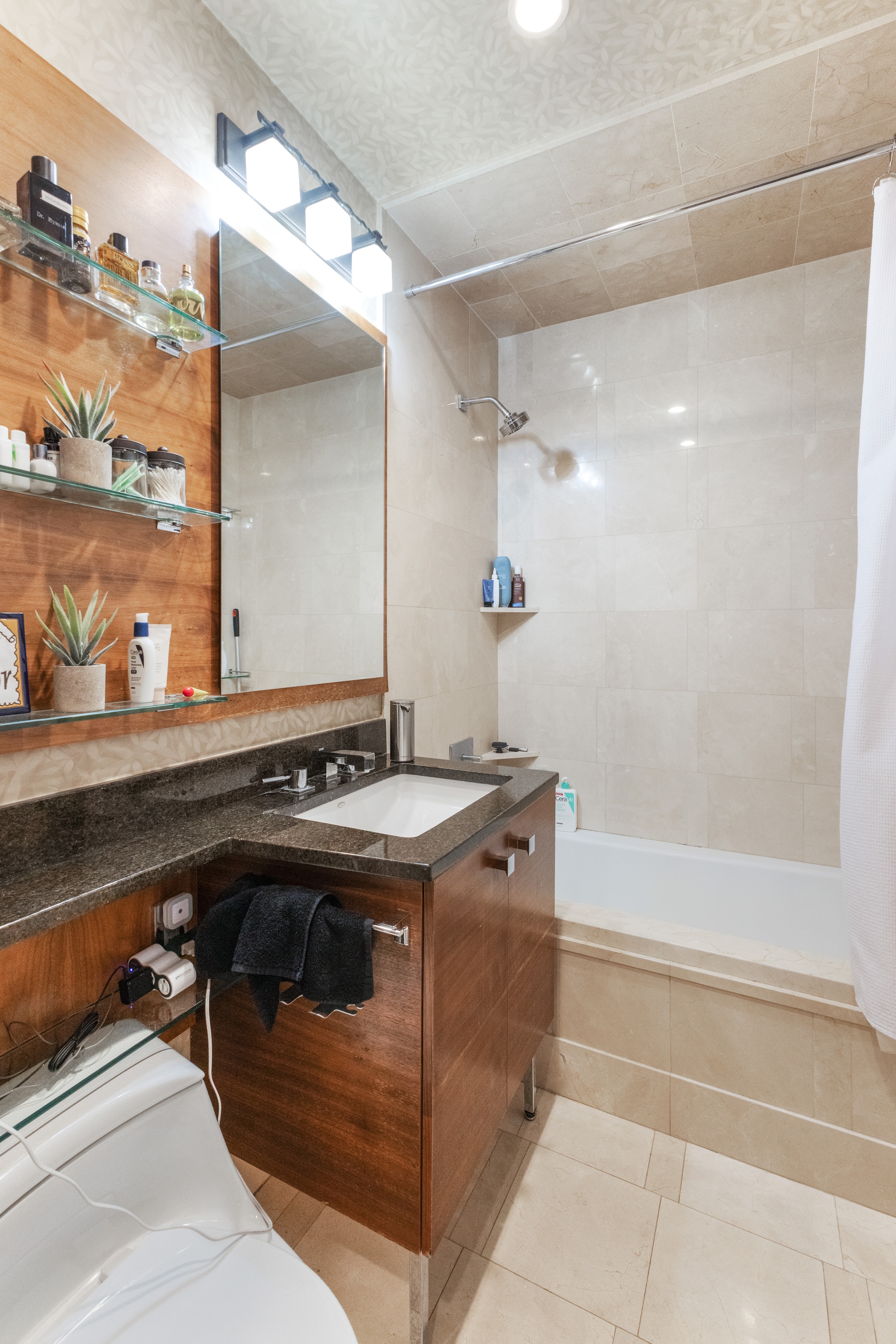 120 Riverside Boulevard, Unit 14C Manhattan, NY 10069 - Photo 8 of 11 a bathroom with a sink and a mirror