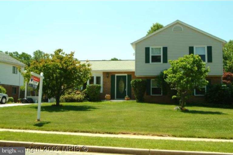 6307 Brooklyn Bridge Road Laurel, MD 20707 - Photo 1 of 17 a front view of a house with a yard