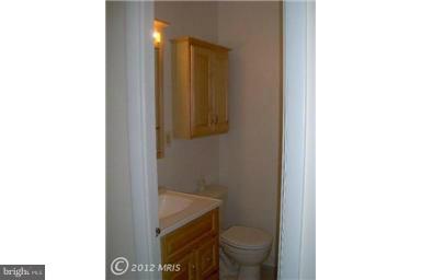 6307 Brooklyn Bridge Road Laurel, MD 20707 - Photo 3 of 17 a bathroom with a sink and a toilet