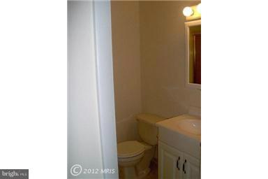 6307 Brooklyn Bridge Road Laurel, MD 20707 - Photo 6 of 17 a bathroom with a toilet and a sink