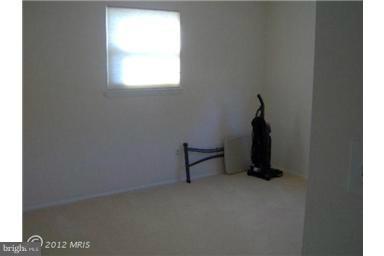 6307 Brooklyn Bridge Road Laurel, MD 20707 - Photo 7 of 17 a room that has a window and a table in it