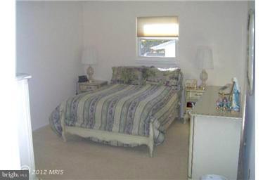 6307 Brooklyn Bridge Road Laurel, MD 20707 - Photo 8 of 17 a bedroom with a bed and a window