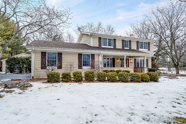 38W194 Pine Road St. Charles, IL 60175 - Photo 1 of 24 a front view of a house with a yard