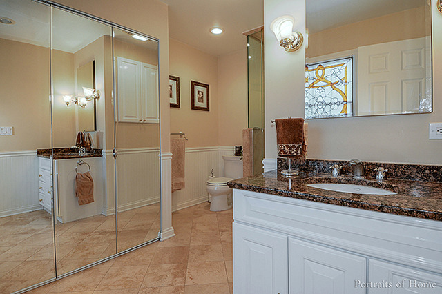 38W194 Pine Road St. Charles, IL 60175 - Photo 13 of 24 a bathroom with a granite countertop sink a mirror and a shower