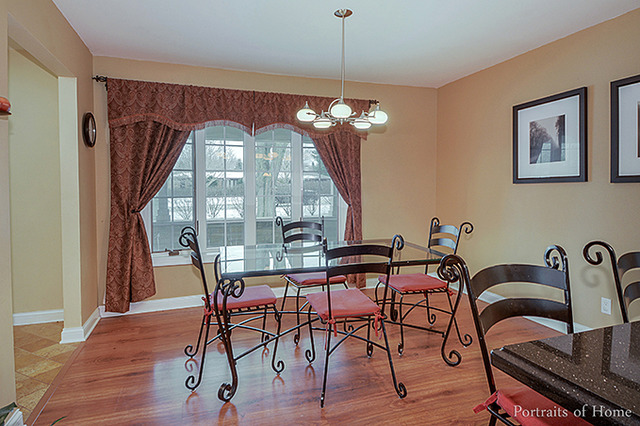38W194 Pine Road St. Charles, IL 60175 - Photo 6 of 24 a view of a dining room with furniture window and wooden floor