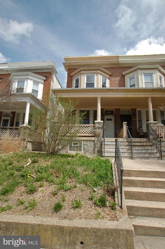 3735 Reisterstown Road Baltimore, MD 21215 - Photo 1 of 29 a front view of a house with a yard