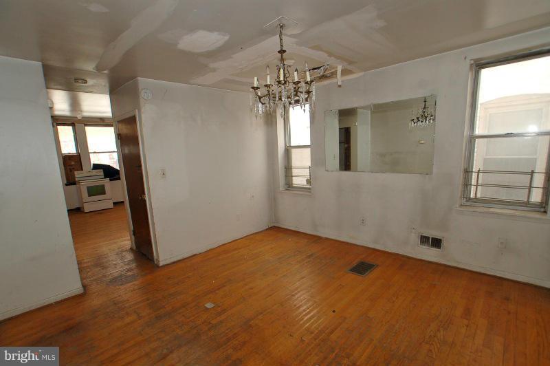 3735 Reisterstown Road Baltimore, MD 21215 - Photo 21 of 29 a view of a room with window and wooden floor