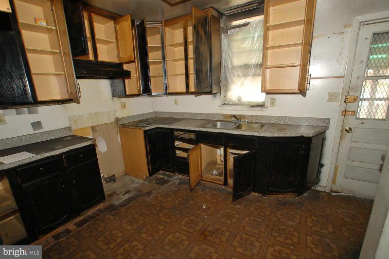 3735 Reisterstown Road Baltimore, MD 21215 - Photo 24 of 29 a kitchen with a sink and a window