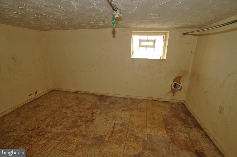 3735 Reisterstown Road Baltimore, MD 21215 - Photo 5 of 29 a view of an empty room and a window