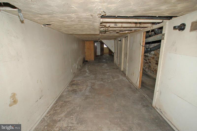 3735 Reisterstown Road Baltimore, MD 21215 - Photo 9 of 29 a view of a hallway with wooden shelves