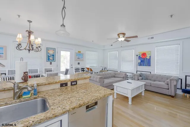 a kitchen with a stove a refrigerator and a sink