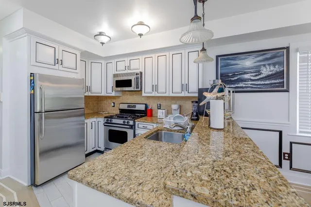 a kitchen with a stove and a sink