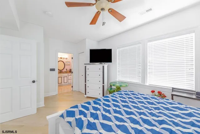 a room with a wooden cabinets and a window