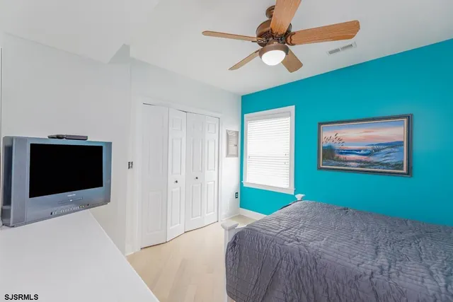 a bedroom with a bed and a table in it