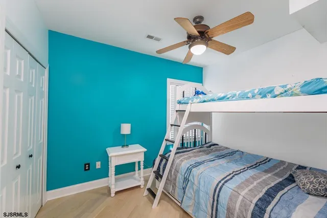 a bathroom with a granite countertop toilet sink and mirror
