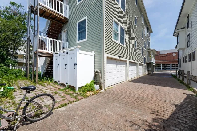 a view of a chair and tables in the balcony
