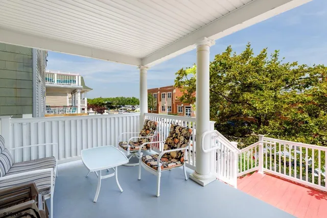 a view of a patio with a table chairs and a patio