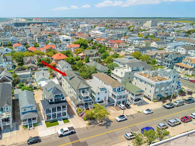 an aerial view of residential houses with street view