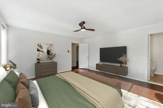 a bedroom with a bed and a couch