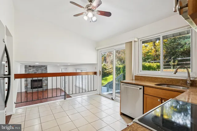 a view of a porch with wooden floor and furniture
