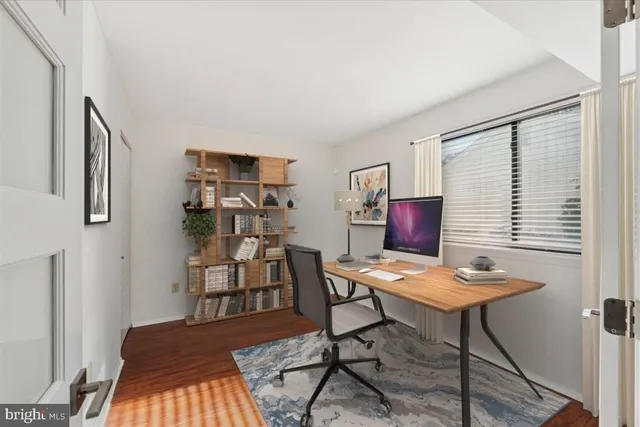 a workspace with furniture and window